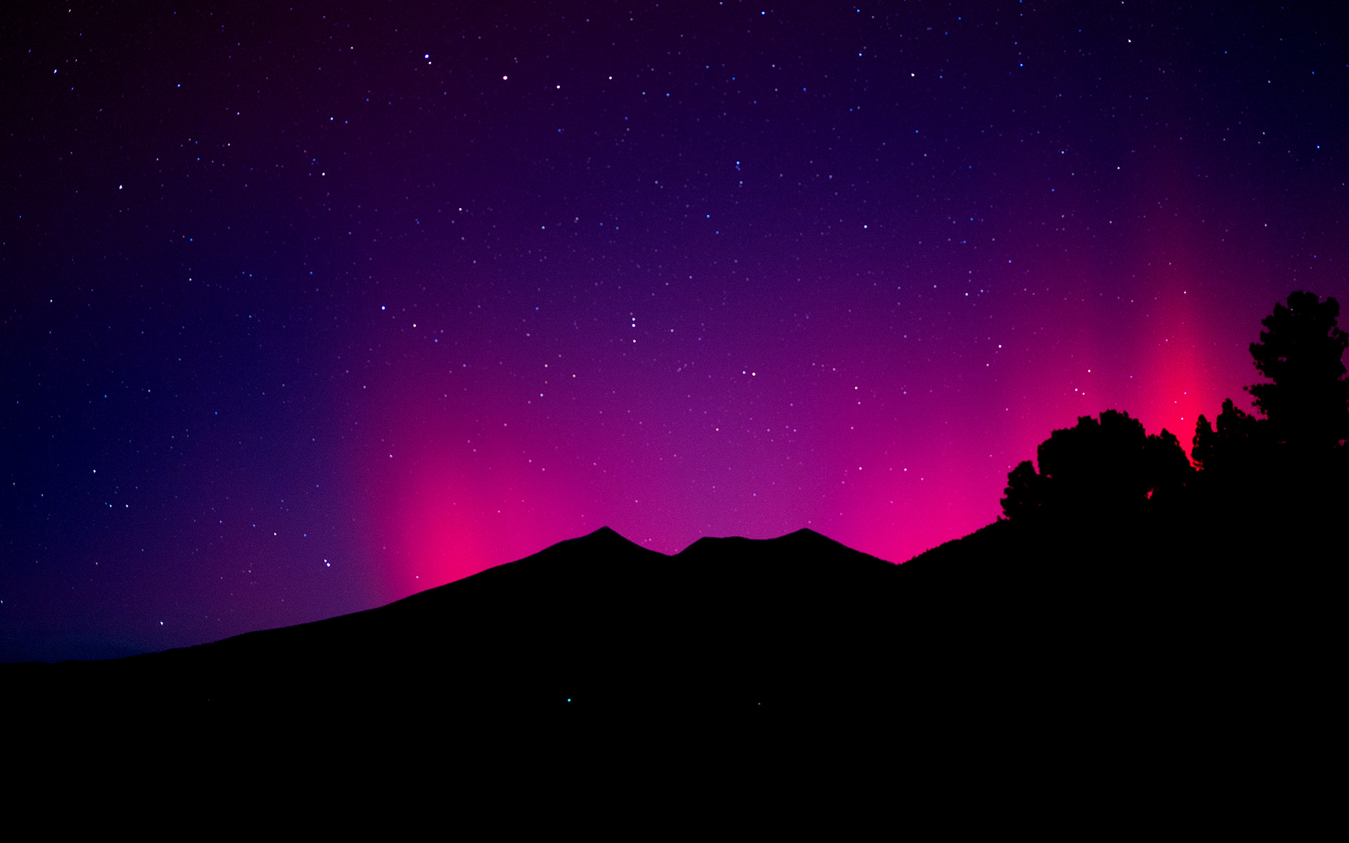 Aurora Borealis visible over the San Francisco Peaks and Flagstaff Arizona on October 10, 2024